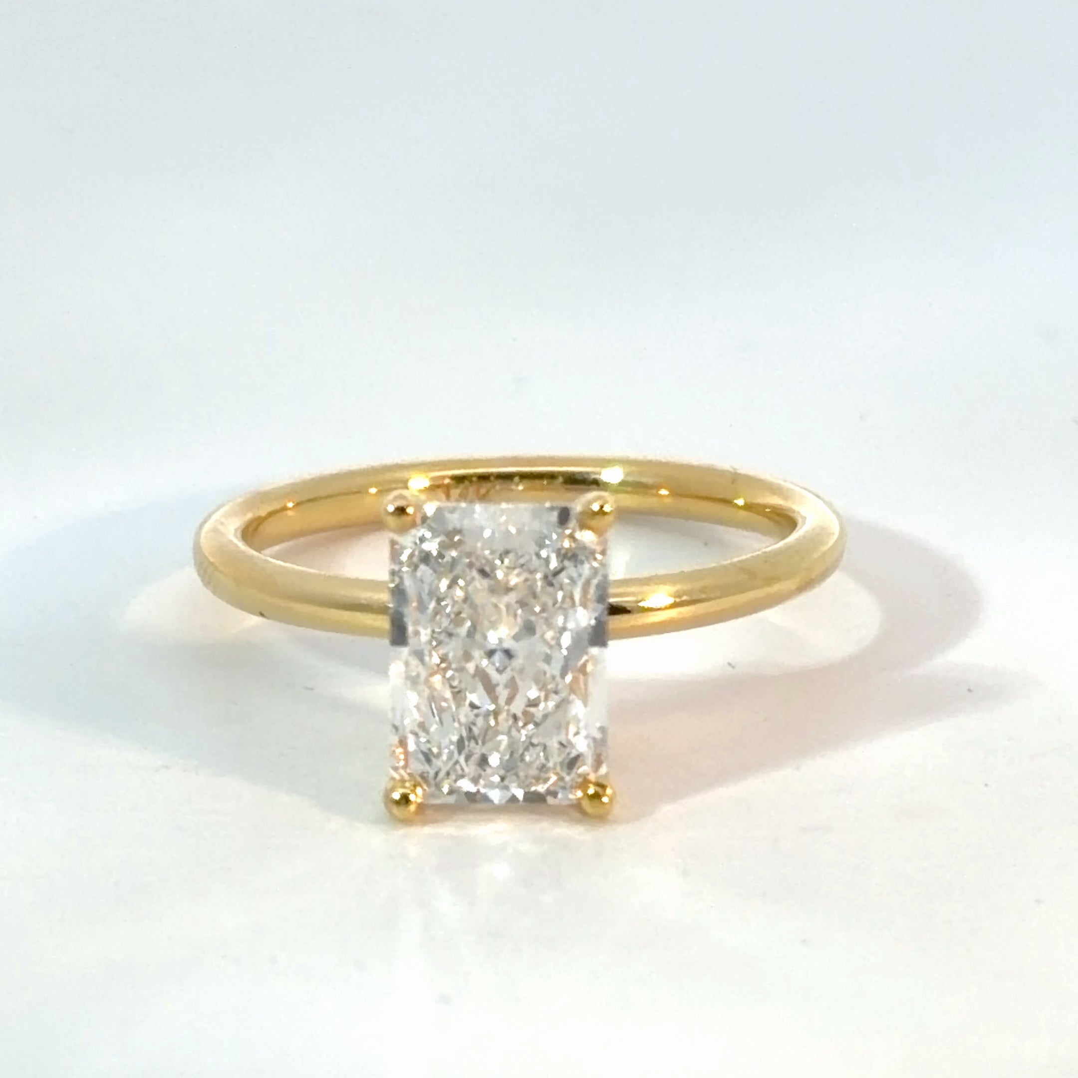 Radiant Solitaire Cathedral Setting – Yellow Gold